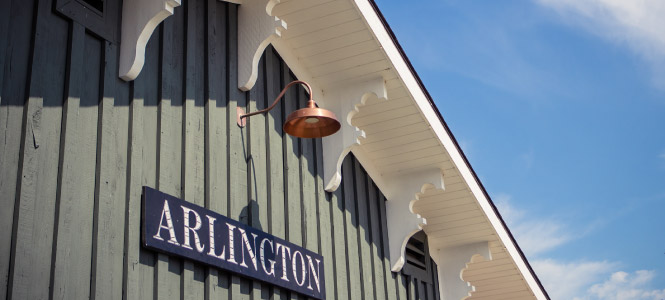 Close up of a sign on a building that says "ARLINGTON"